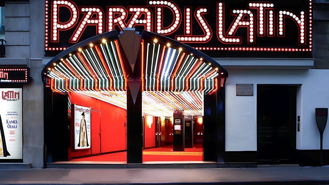Paradis Latin entrance with illuminated marquee in Paris.