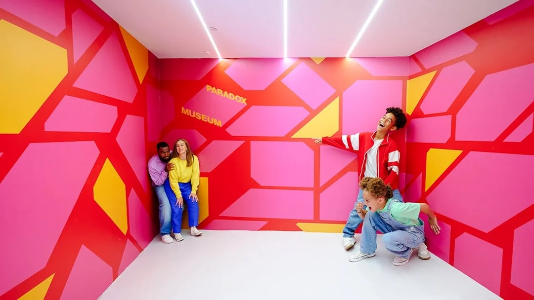 Guests enjoying an interactive exhibit at the Paradox Museum London.