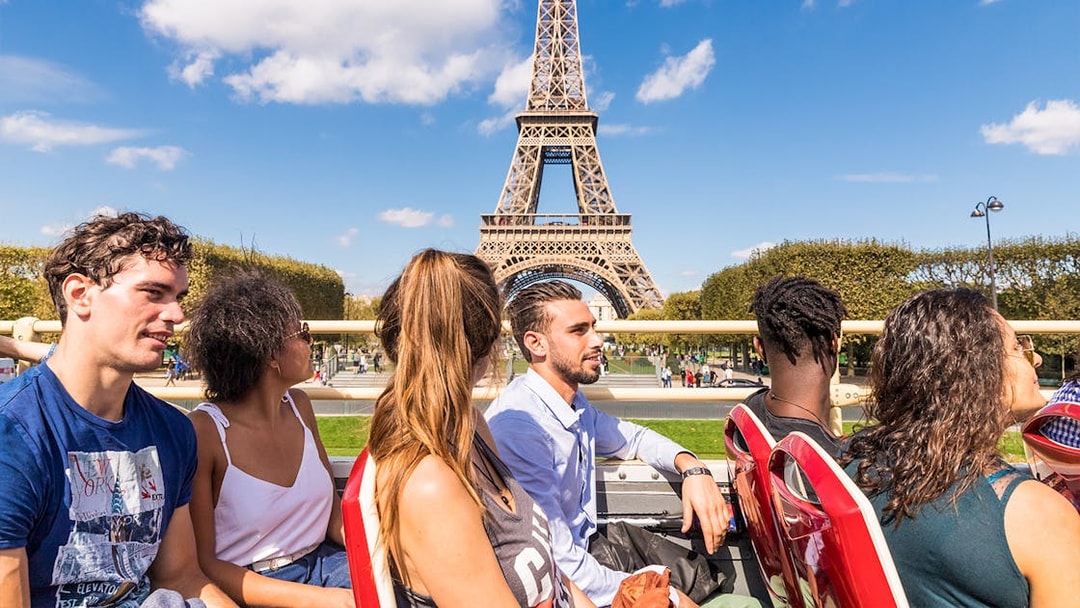 Tourists on a Big Bus tour near the Eiffel Tower in Paris.