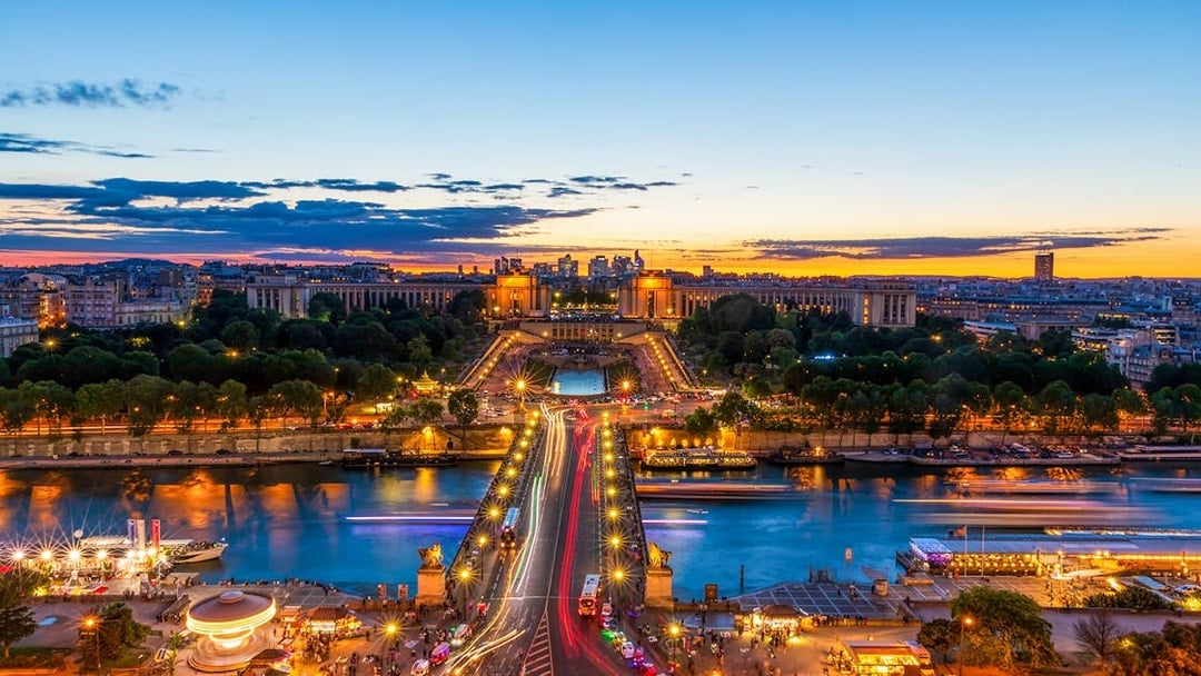 View of Trocadéro Gardens and Seine River from Eiffel Tower's 1st floor at sunset, Paris.