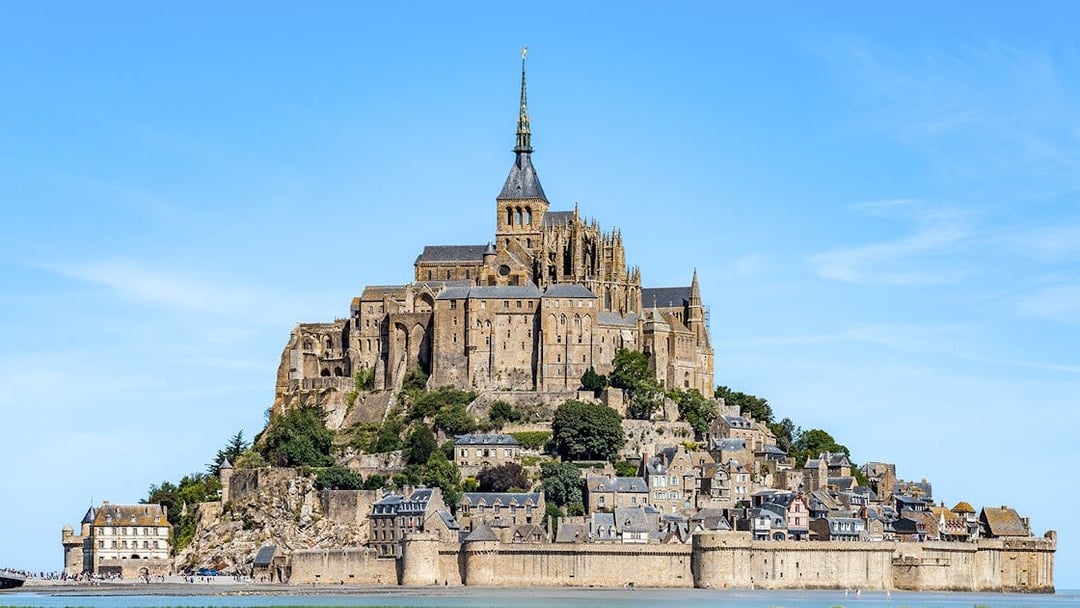 Mont St. Michel abbey and village on tidal island, Normandy, France.