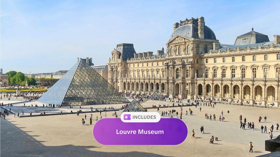 Louvre Museum courtyard with glass pyramid in Paris.