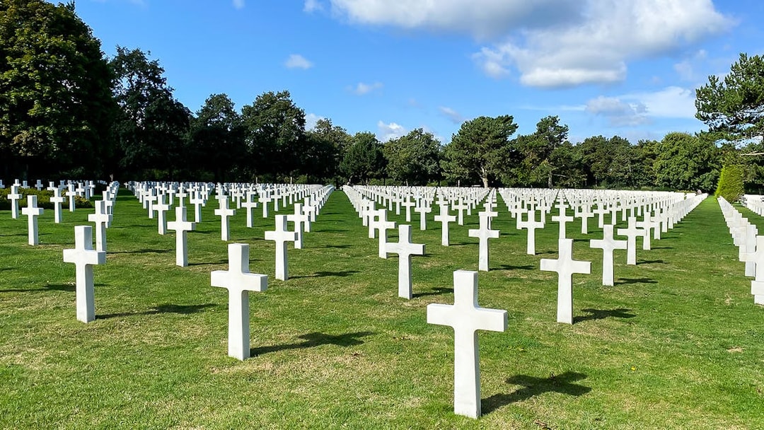 Rows of white crosses at Normandy American Cemetery, France, on a D-Day Normandy Beaches day trip from Paris.