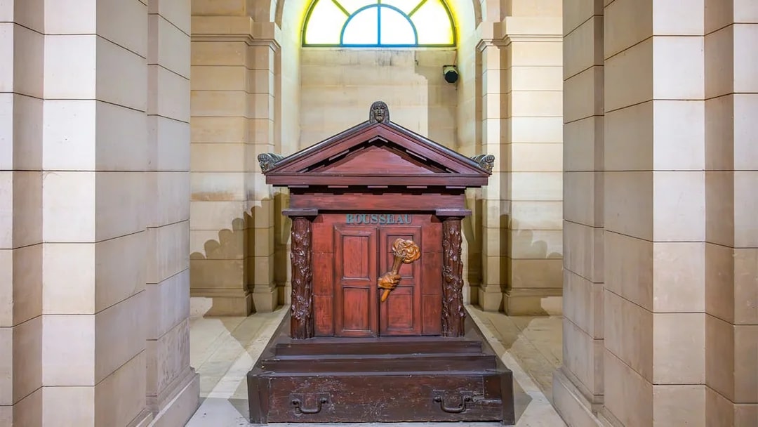 Tomb of Rousseau in the Paris Pantheon, featuring ornate carvings and classical architecture.