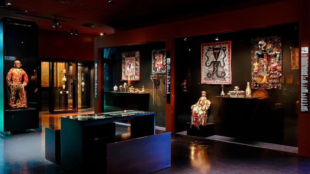 Quai Branly Museum interior exhibit with cultural artifacts, Paris.