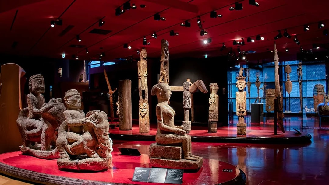 Quai Branly Museum interior with sculptures, Paris.