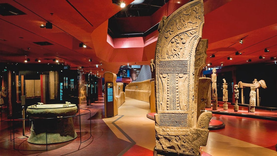 Quai Branly Museum interior with ancient artifacts, Paris.