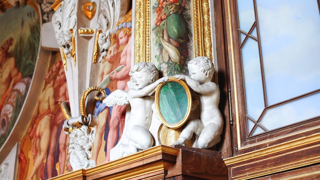Cherubs and ornate frescoes in Château de Fontainebleau Grand Apartments.