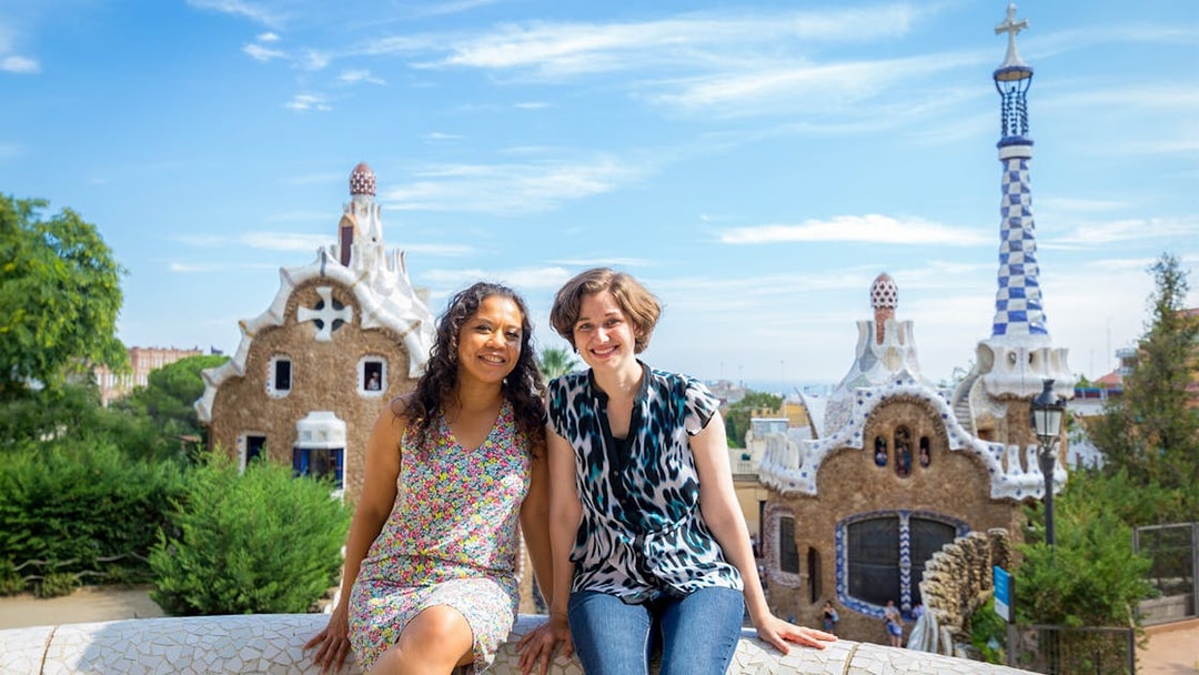 Visitors enjoying Park Güell's unique architecture on a guided tour in Barcelona.