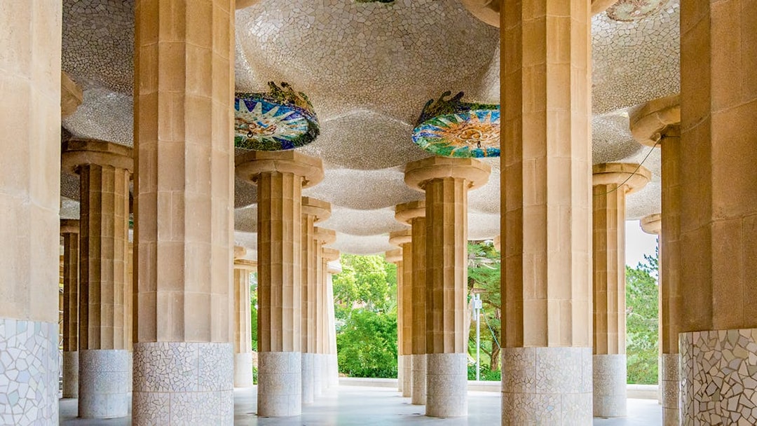 Columns and mosaic ceiling of Hypostyle Hall in Park Guell, Barcelona.