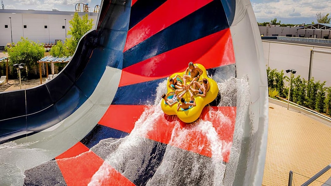 Visitors on a raft slide at Parque Warner Beach, Madrid.