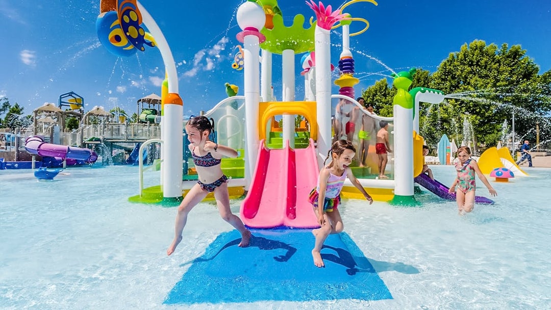 Children playing at water playground in Parque Warner Beach, Madrid.