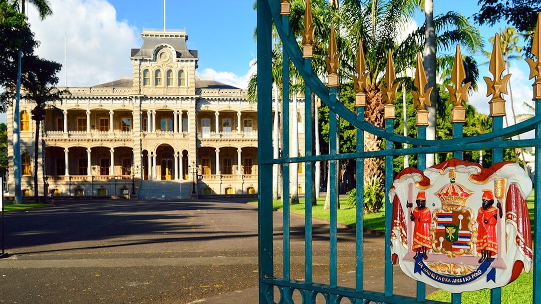 Open gates leading to Iolani Palace, Honolulu, the only royal palace in the United States.