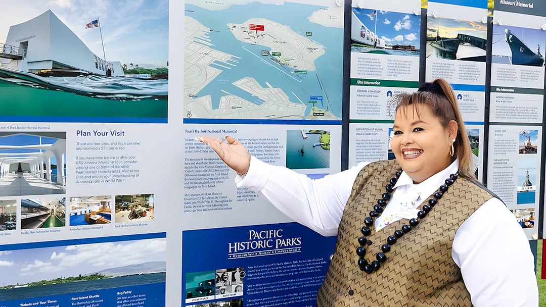 Tour guide on Royal Star Hawaii explaining Pearl Harbor National Memorial map.