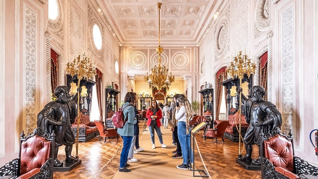 Visitors exploring ornate interior during Pena Palace guided tour.