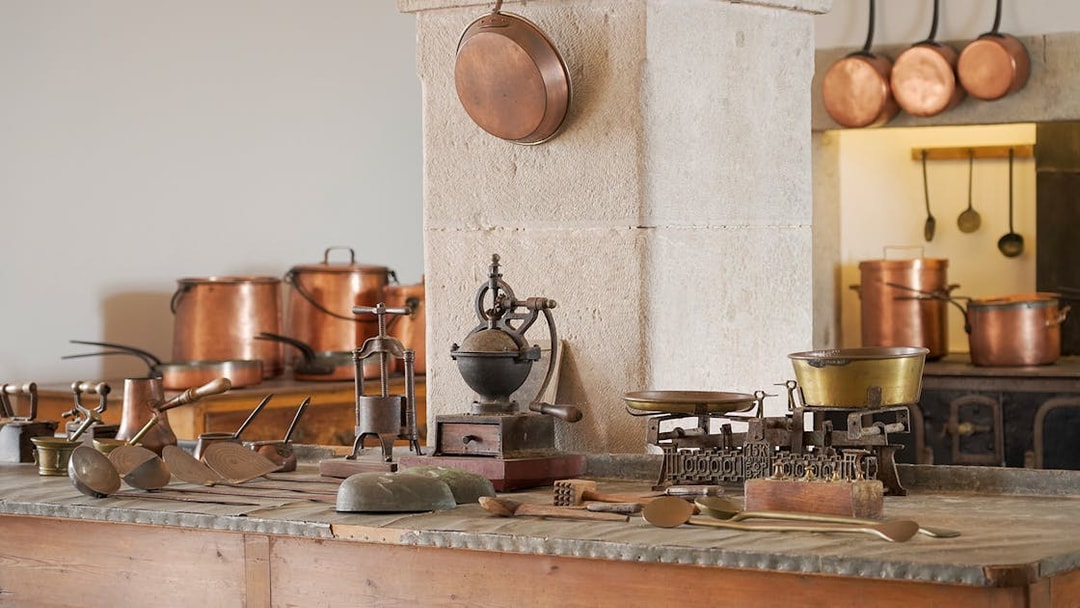 Kitchen tools and copper pots in the historic kitchen of Pena Palace, Sintra, Portugal.