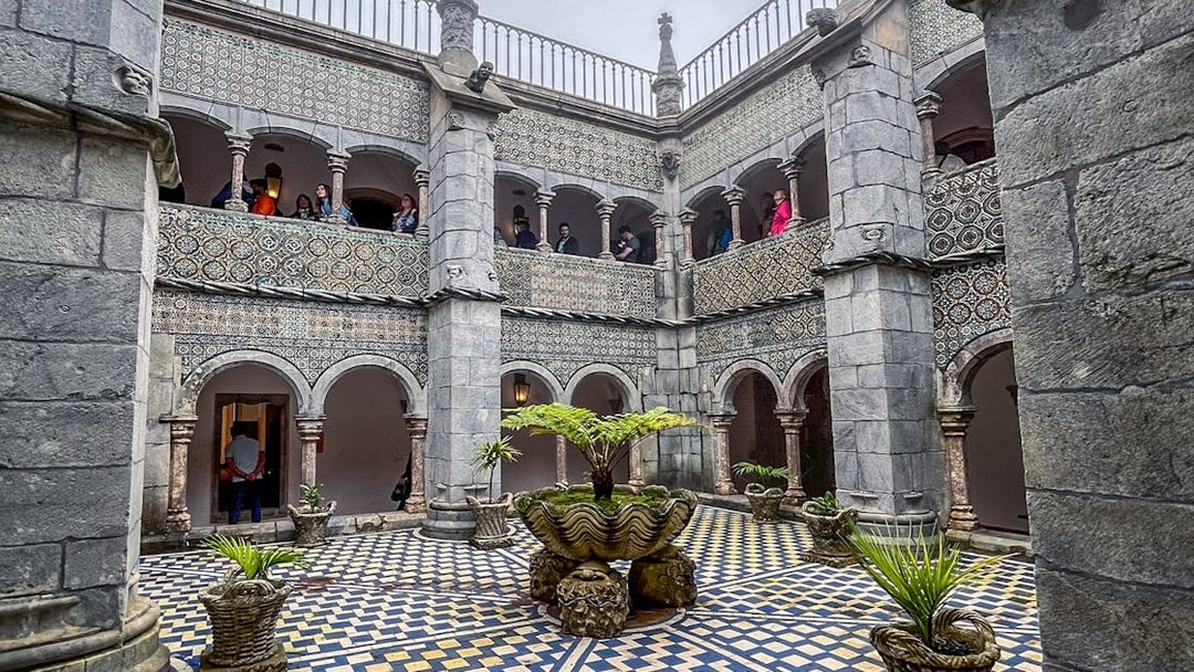 Manueline cloister with tiled walls and arches at Pena Palace, Sintra.