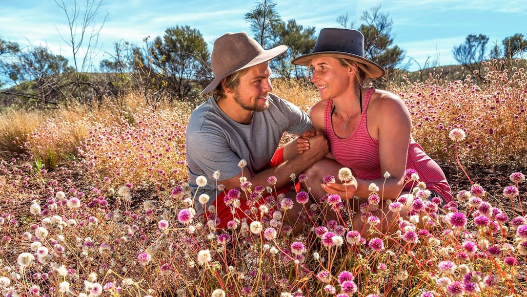 Couple enjoying wildflowers on Pinnacles Lobster Lavender Tour near Perth.