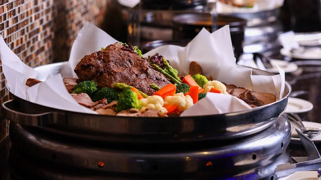 Buffet with roasted meat and vegetables at ARAS restaurant, KL Tower, Kuala Lumpur.
