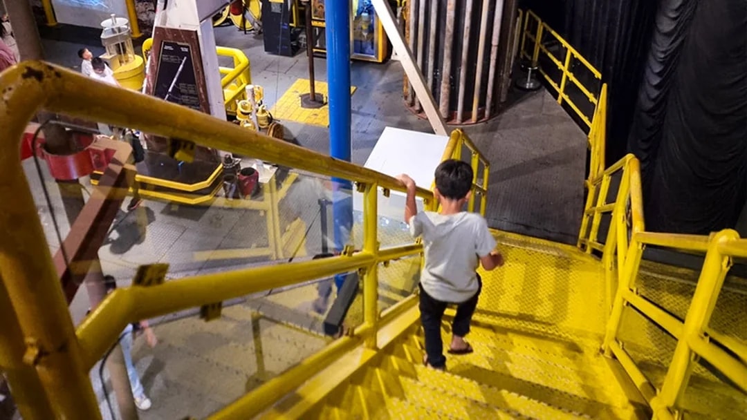 Child exploring interactive exhibit at Petrosains, The Discovery Centre in Kuala Lumpur.