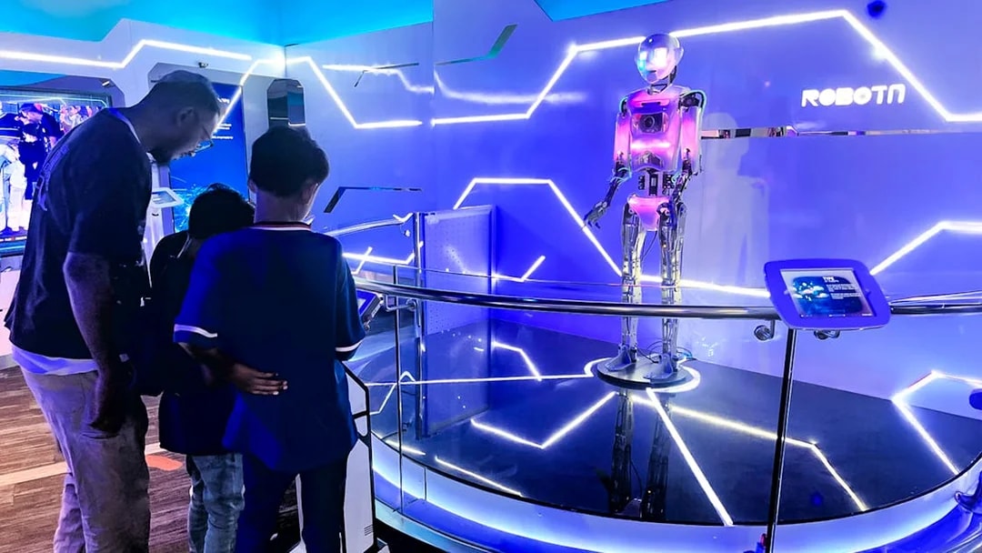Visitors observing a robot exhibit at Petrosains, The Discovery Centre in Kuala Lumpur.