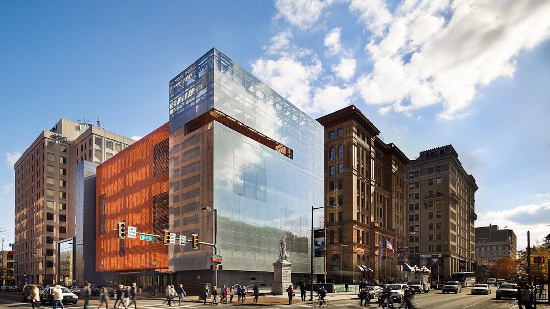 National Museum of American Jewish History building in Philadelphia with pedestrians crossing.