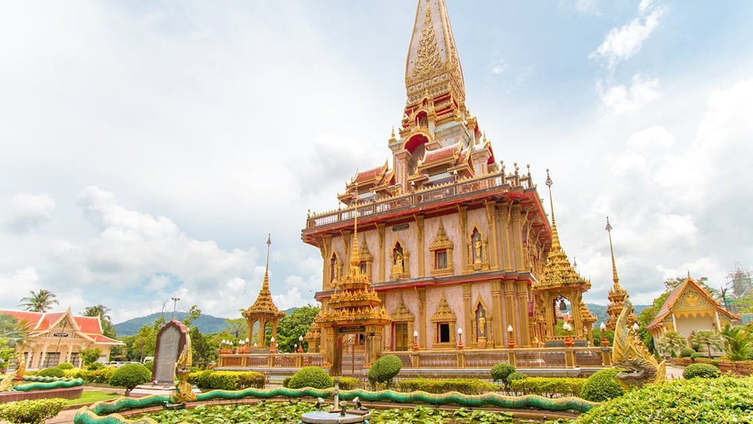 Wat Chalong temple with ornate architecture and dragon sculptures in Phuket, Thailand.