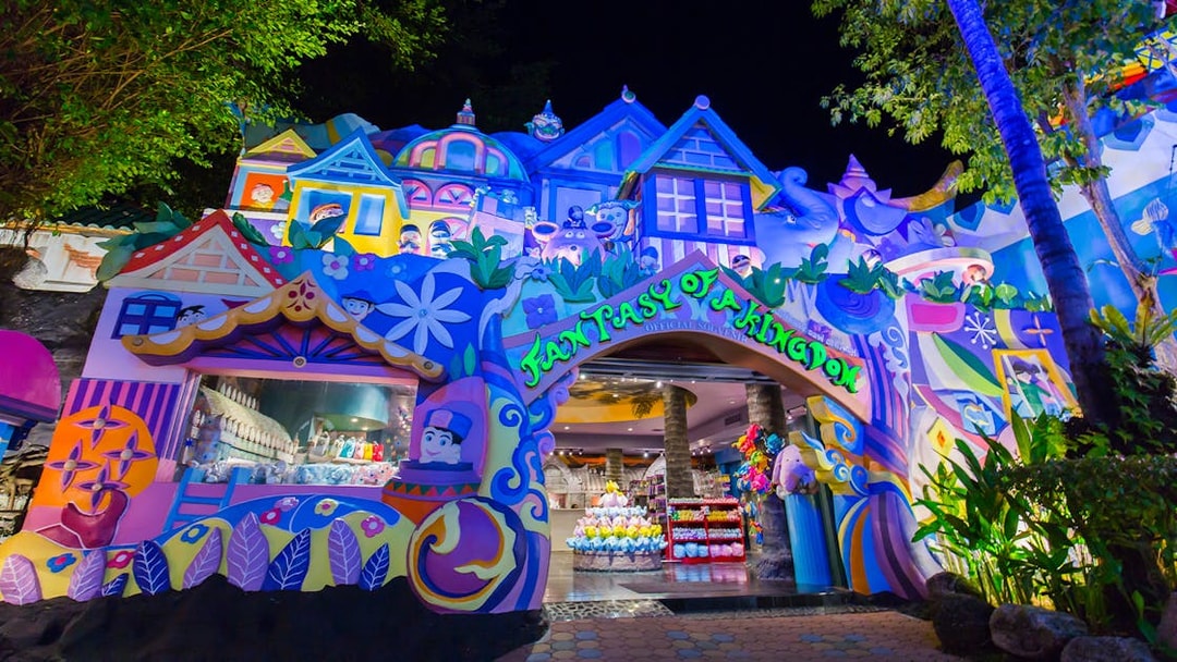 Colorful entrance to Phuket Fantasea theme park in Thailand at night.