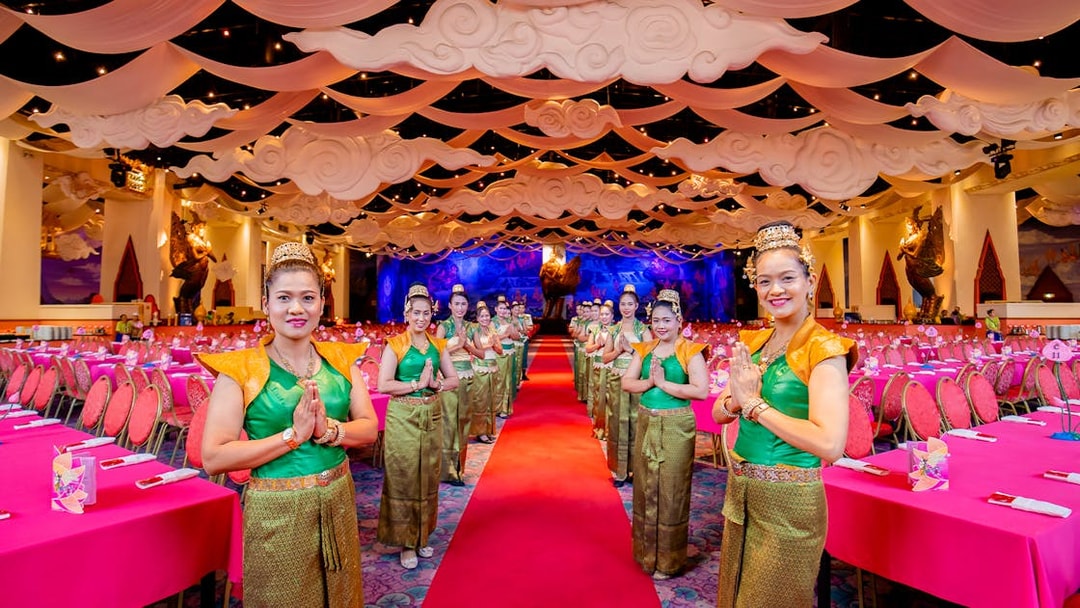Staff welcoming guests at The Golden Kinnaree Buffet Restaurant, Phuket Fantasea.