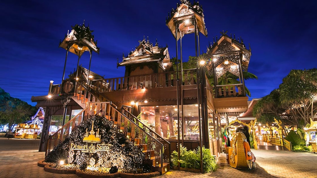 Phuket Fantasea entrance with traditional Thai architecture at night.