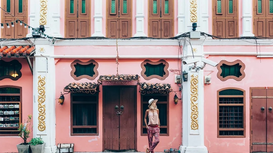 Colorful Sino-Portuguese building in Phuket Old Town during a guided tour.