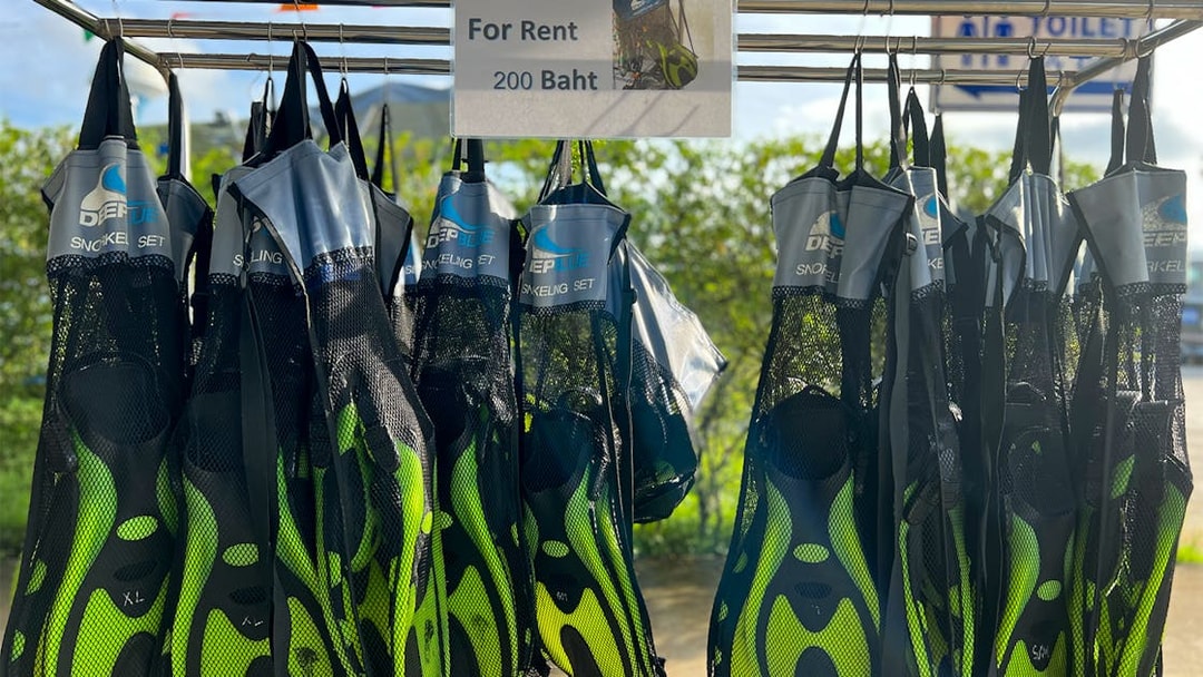 Snorkeling fins for rent displayed in Phuket, Thailand.