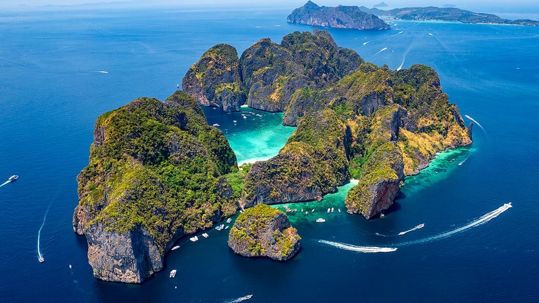 Aerial view of Phi Phi Islands with turquoise waters and lush greenery, Phuket, Thailand.