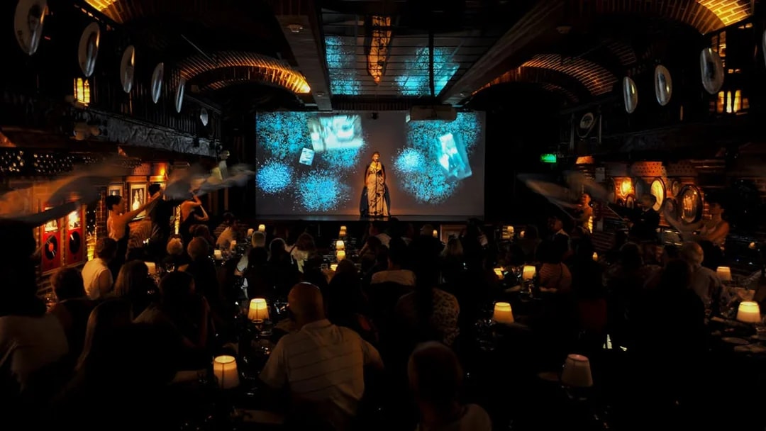 Audience enjoying Piazzolla Tango Show with performers on stage in Buenos Aires.