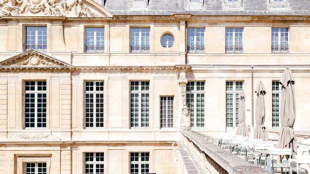 Picasso Museum terrace cafe with closed umbrellas, Paris, France.