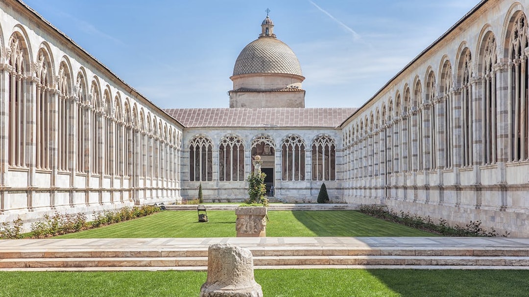 Camposanto Monumentale courtyard with arches, Pisa Cathedral Square, Italy.