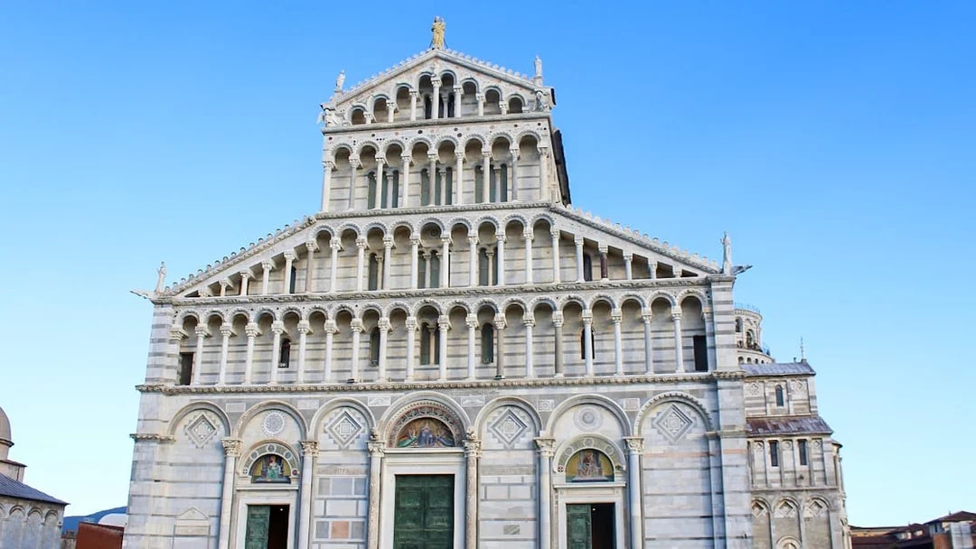 Pisa Cathedral facade with tourists on a 2-hour guided tour.