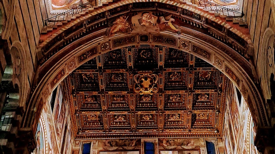 Ornate ceiling inside Pisa Cathedral on Field of Miracles tour.