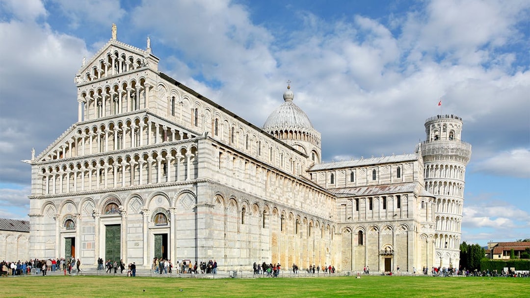 Pisa Cathedral facade with tourists, part of Pisa Monumental Complex, Italy.
