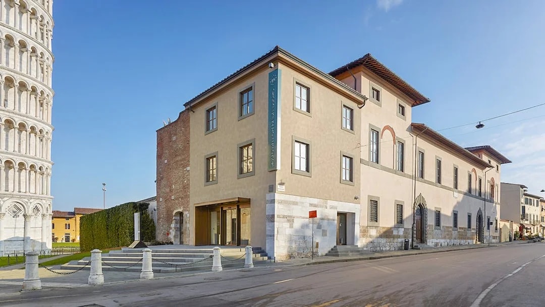 Opera del Duomo Museum exterior in Pisa with Leaning Tower visible nearby.