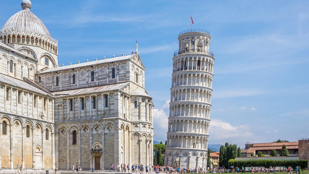 Leaning Tower of Pisa with Pisa Cathedral on the left during a walking tour.