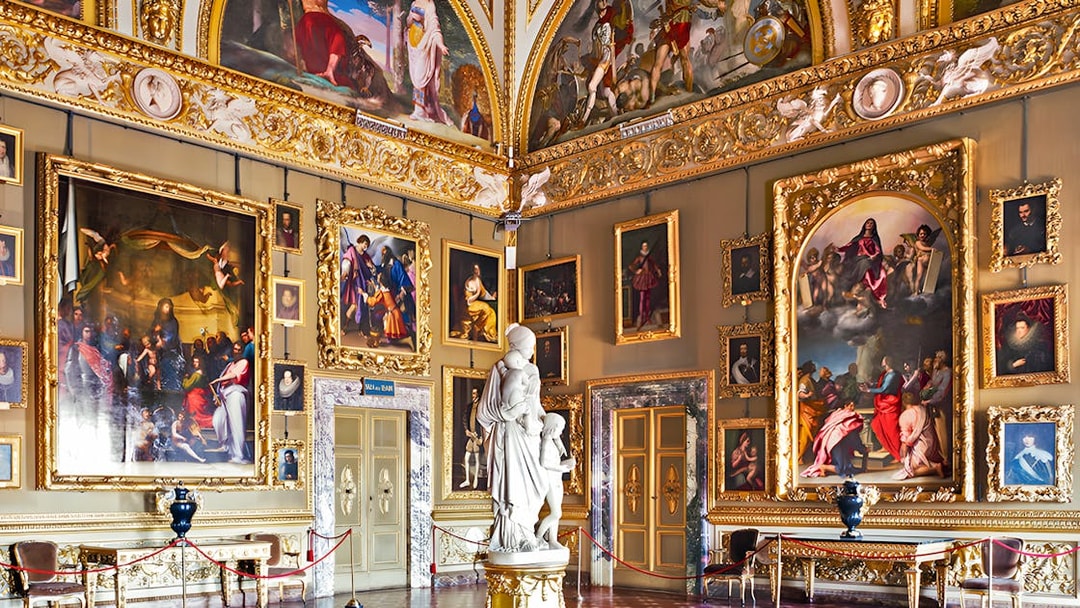 Pitti Palace interior with ornate paintings and sculptures, Florence, Italy.