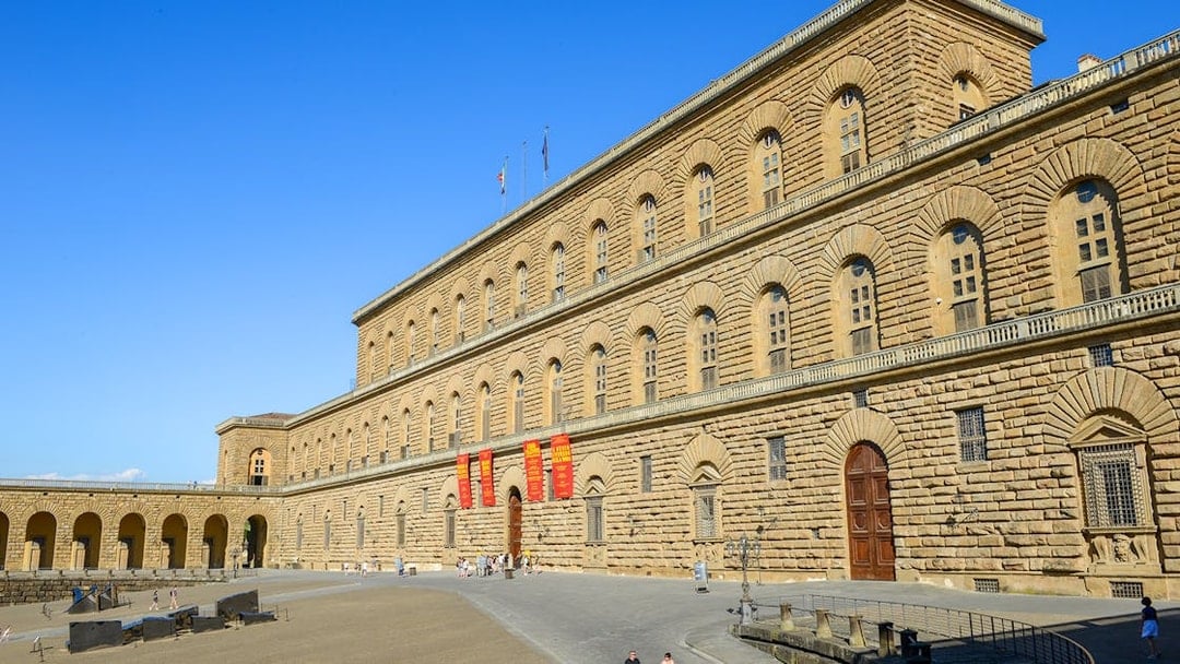 Pitti Palace exterior with visitors, Florence, Italy.