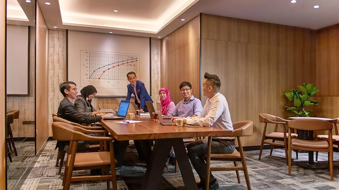 Group meeting in a conference room at Plaza Premium First, Satellite Terminal.