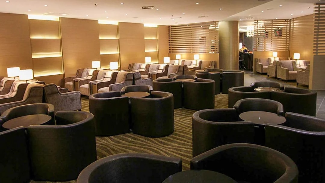 Plaza Premium Lounge seating area with modern chairs and ambient lighting.