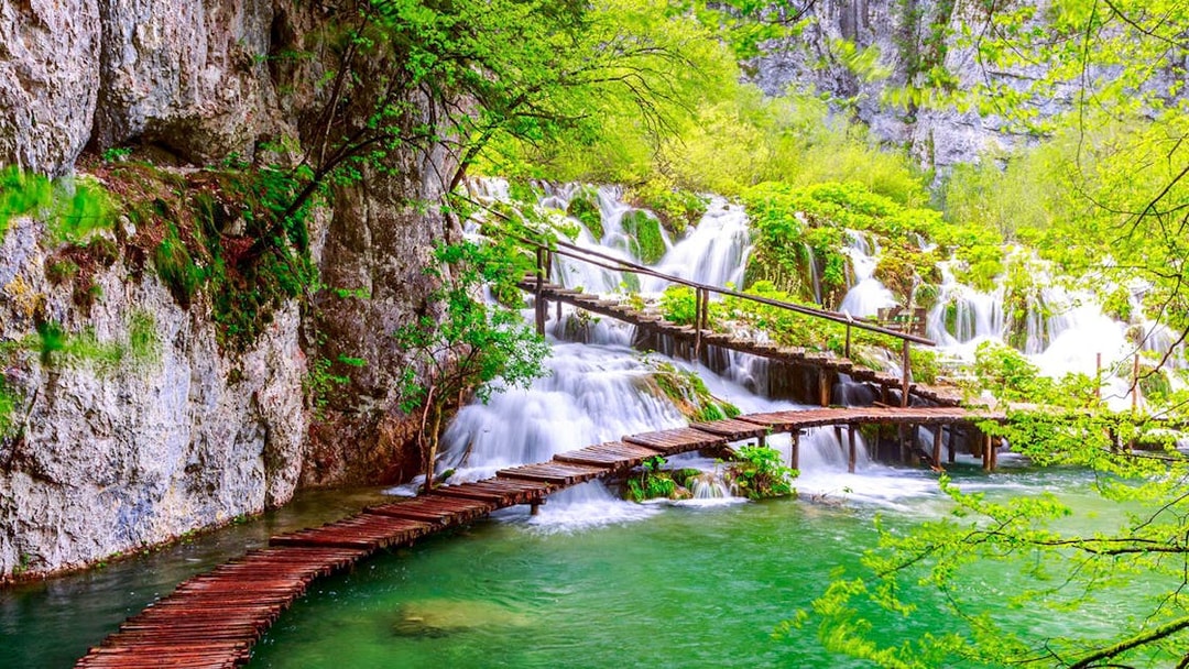 Wooden path over waterfalls at Plitvice Lakes National Park, Croatia.