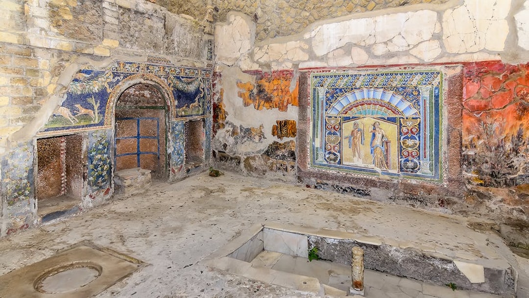 Ancient frescoes and mosaics in a room at Herculaneum, part of the Pompeii & Herculaneum guided tour.
