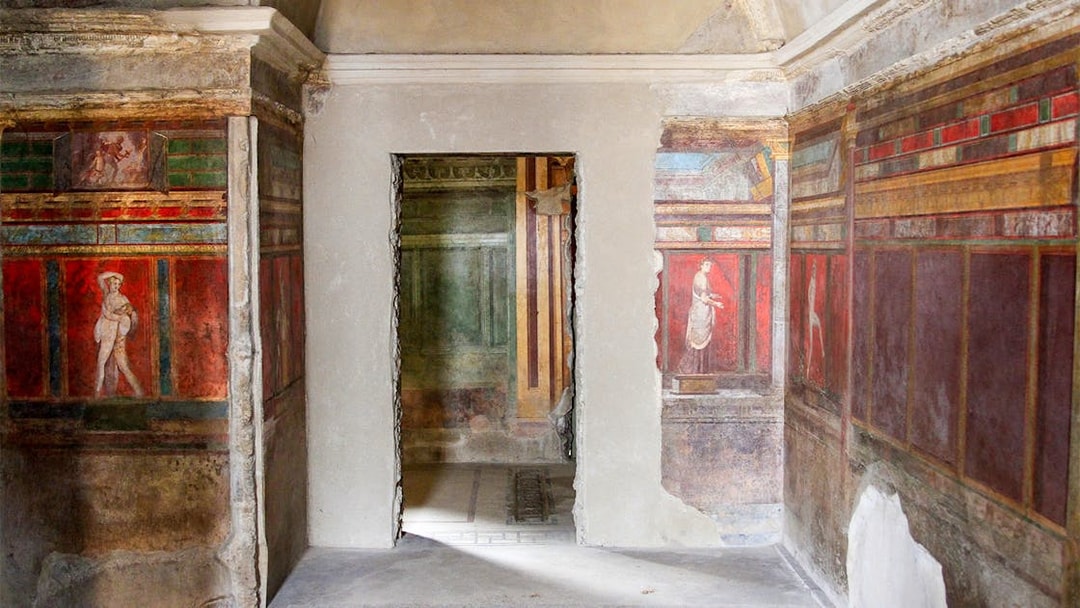 Frescoes in the Villa of the Mysteries, Pompeii, depicting ancient Roman figures.