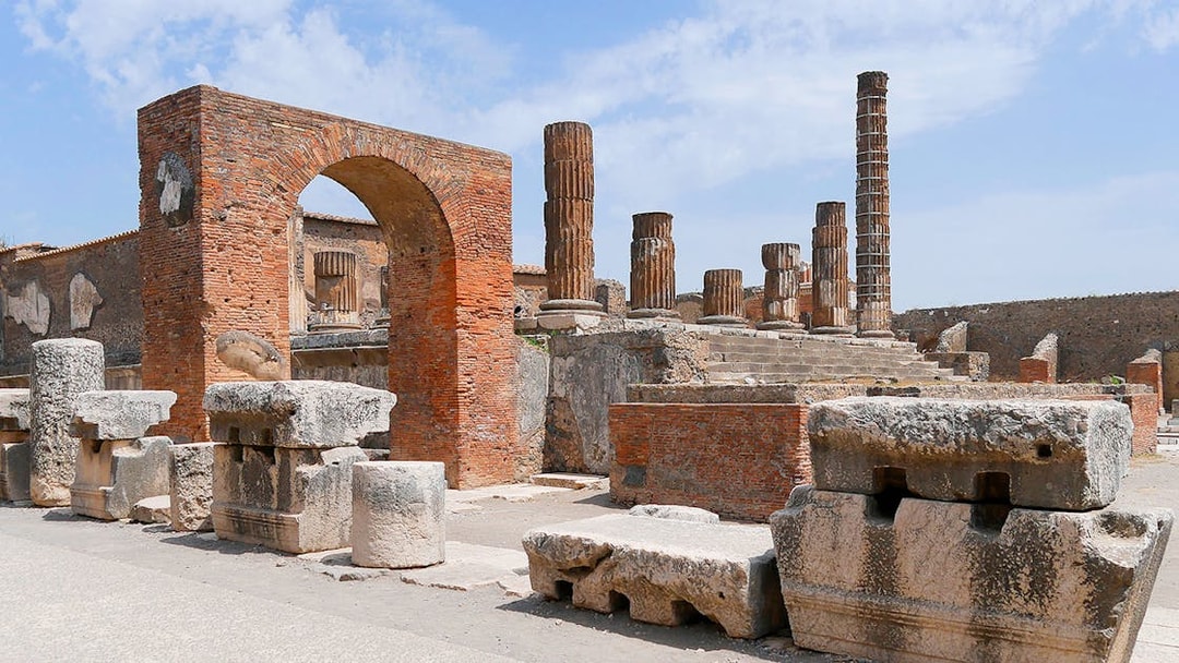 Ancient ruins and columns at Pompeii Forum, Italy.