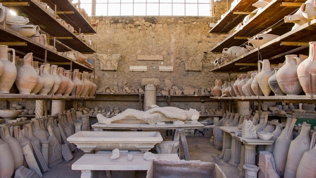 Ancient artifacts and plaster cast in Pompeii storage room.